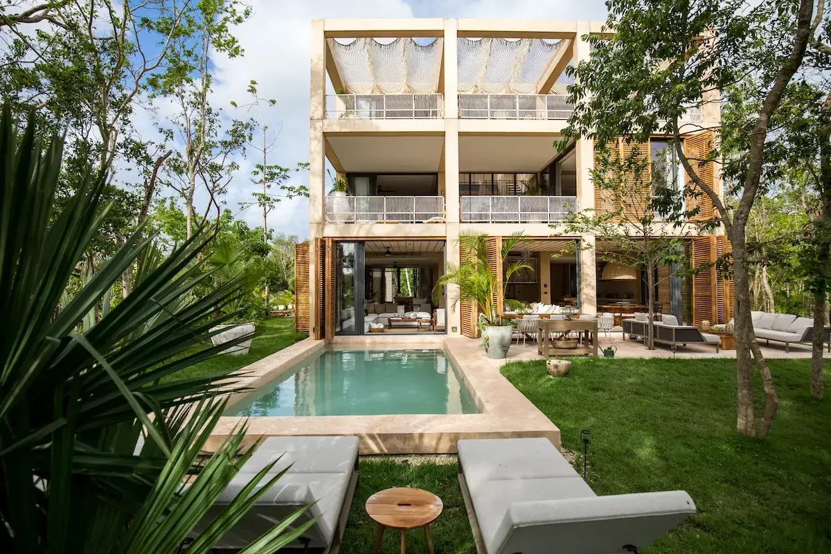 corasol-palm-villas-playa-del-carmen-exterior.webp Cubic-style Palm Villa estate home at Corasol, Playa del Carmen, designed by Sordo Madaleno