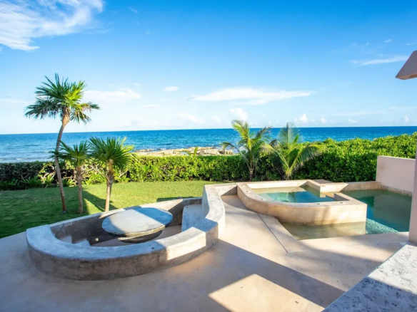 Seaside pool and terraces of the Akumal beachfront villa at Punta Sur