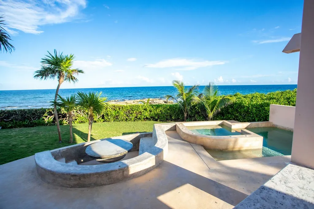 akumal-beachfront-villa-seaside-pool.webp Seaside pool and terraces of the Akumal beachfront villa at Punta Sur