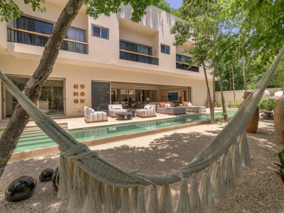 Ground-floor lap pool and private garden at Villa Xatá in Aldea Zama, Tulum
