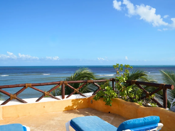 Back terrace, private pool, and sea views at the Punta Caracol villa, Puerto Morelos