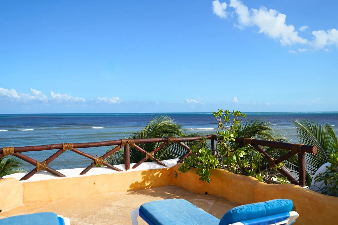 Back terrace, private pool, and sea views at the Punta Caracol villa, Puerto Morelos