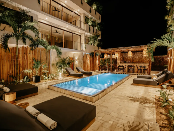 Marble-striped infinity common pool between the two buildings at Majaró boutique hotel in La Veleta Tulum