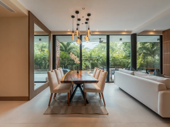 Open-plan living, dining and kitchen with 3-metre ceilings in a SOLEii condo, Playacar.