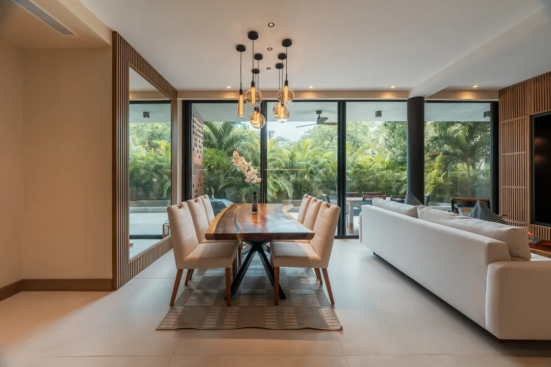 soleii-playacar-open-living-kitchen.webp Open-plan living, dining and kitchen with 3-metre ceilings in a SOLEii condo, Playacar.