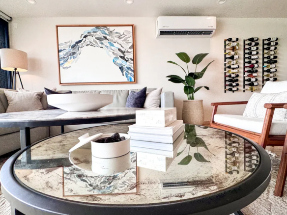 AWA Playacar penthouse open-plan living and dining area with palm tree views