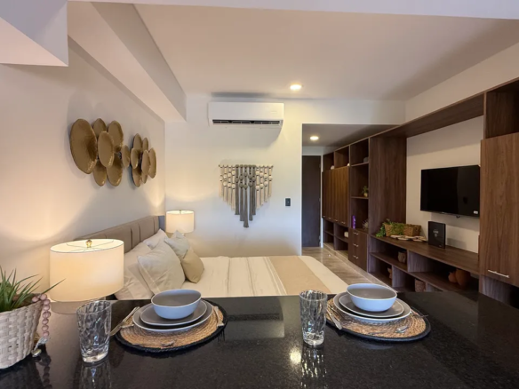 Interior of a delivered studio at Studio 34 Playa del Carmen showing kitchen and living area