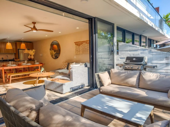 AWA Playacar 2 bedroom condo open-concept living and dining area with designer furniture