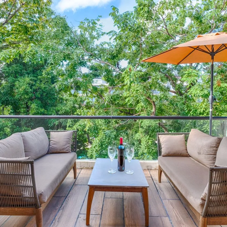 AWA Playacar 2 bedroom condo private terrace with tropical garden and pool views