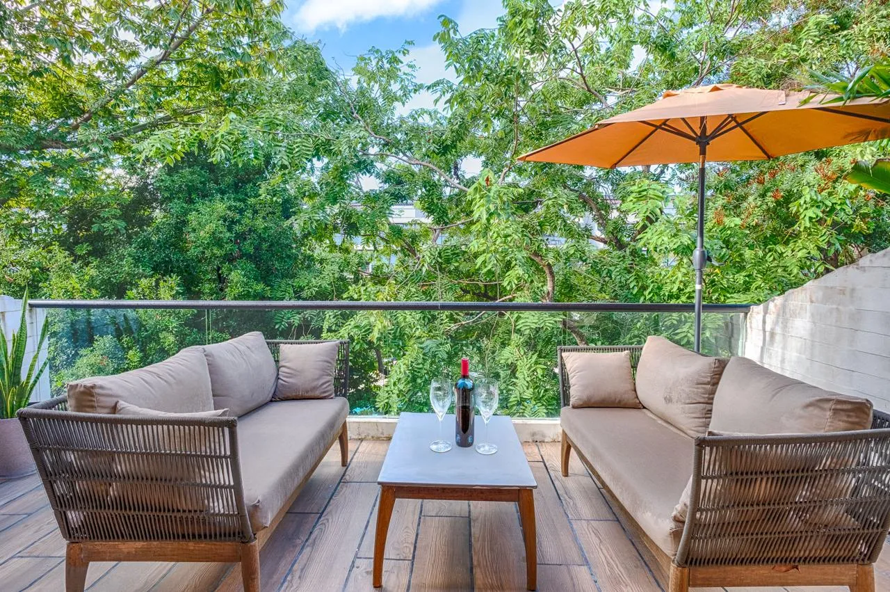 AWA Playacar 2 bedroom condo private terrace with tropical garden and pool views