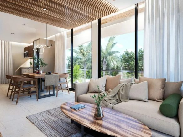Two-bedroom condo interior at DK42 Playa del Carmen showing living area and balcony