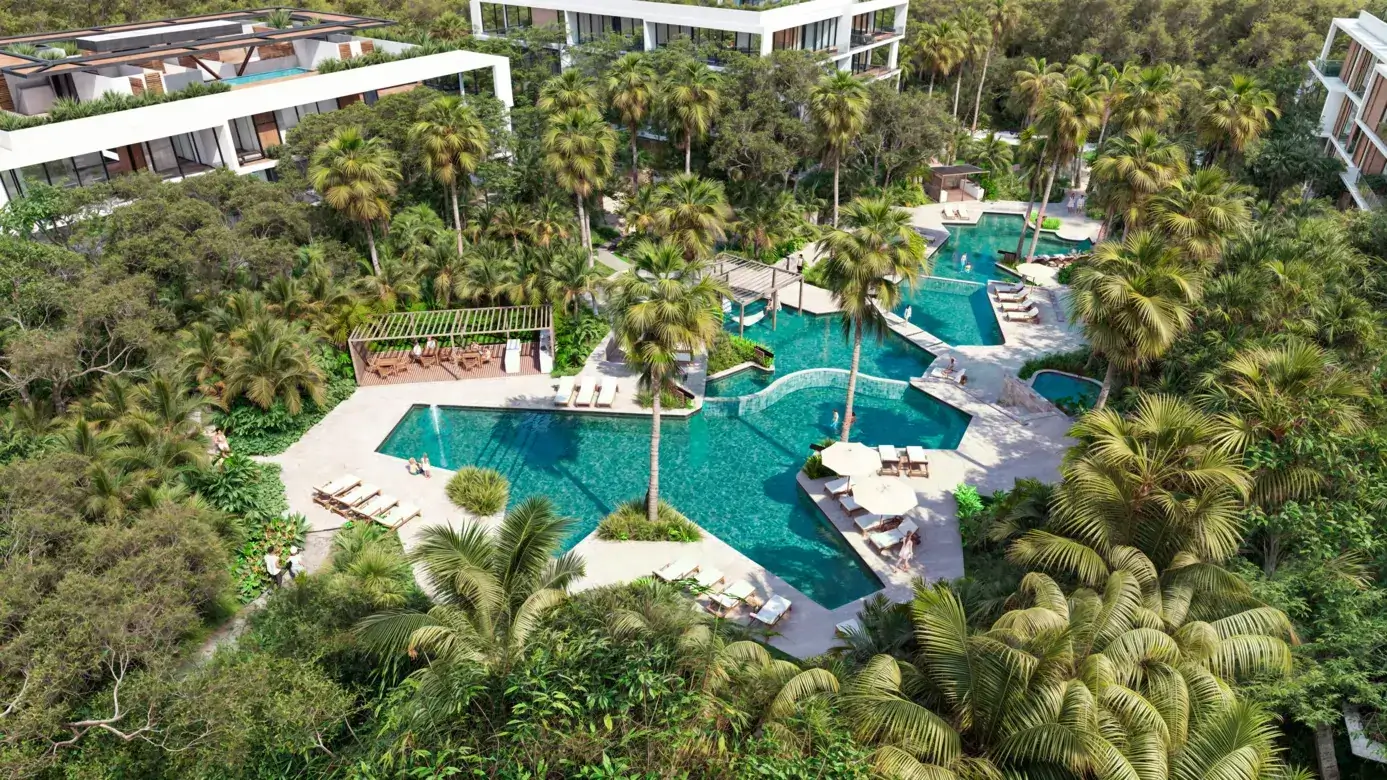 bakaba-playacar-pool-waterfalls.webp Pools with waterfalls and hammocks over the water at Bakabá, Playacar