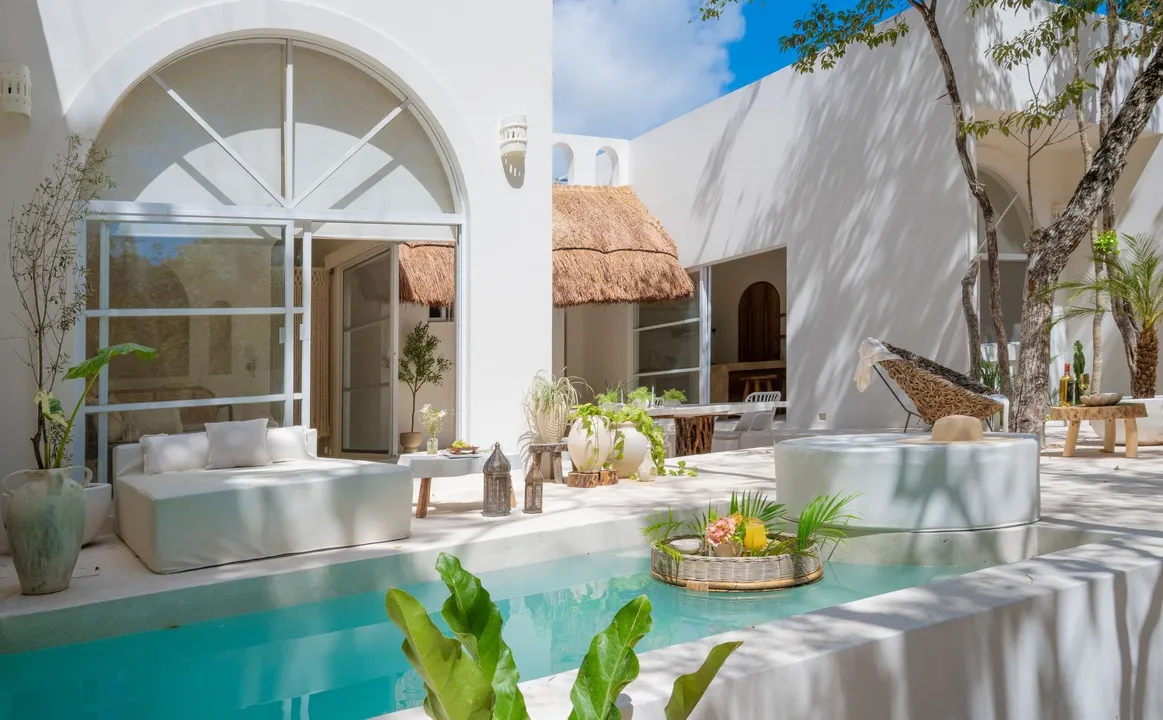 the-sakk-tulum-villa-exterior.webp Exterior of a wellness villa at The Sakk in the Tulum jungle.